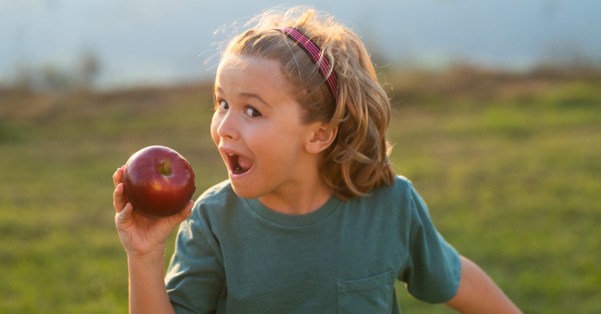 Child Eating an Apple