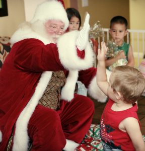 Santa claus gives a high five